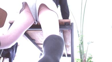 Rubbing against the desk corner with my shorts