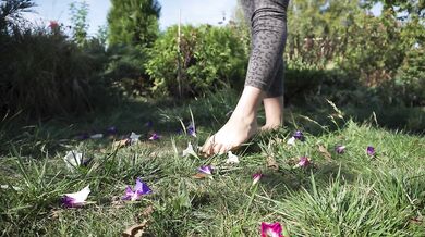Crushing Flowers Barefoot In The Grass