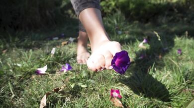 Crushing Flowers Barefoot In The Grass