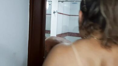 My stepmother enters the shower and gives me a delicious blowjob.