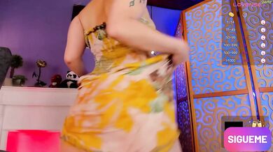 She dances alone sensually until she takes off her floral dress, a peasant from the United States, L