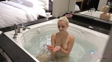 Jade Amber takes a piss before getting fingered, then dips into the hot tub