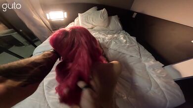 Latina girl with pink hair fucking on the edge of the bed with a tattooed guy with a big dick.