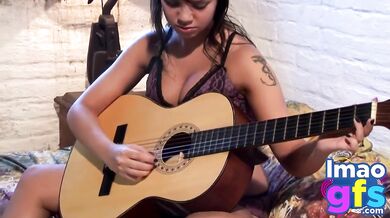 Hot Paul showing her medium tits and pussy with guitar