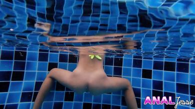 Asian Teen Swimming with Glass Butt Plug