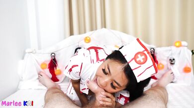Thai Babe in Halloween Costume Sucking Cock