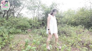A Thai girl stops by the forest beside the walking path before playing with her pussy.