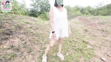 A Thai girl stops by the forest beside the walking path before playing with her pussy.