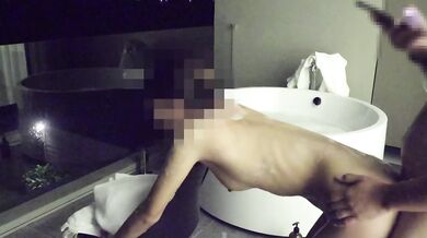 Asian couple having sex in an outdoor jacuzzi, someone is peeking.