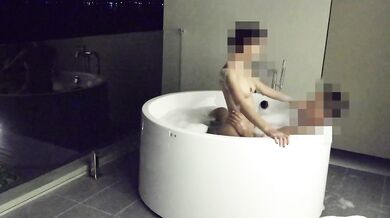 Asian couple having sex in an outdoor jacuzzi, someone is peeking.