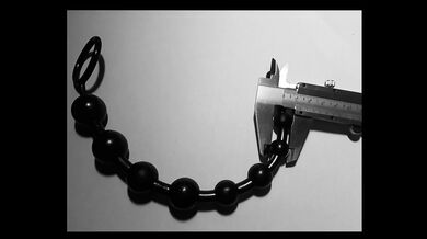 Urethral insertion with ball rod of different sizes [Thai beads]