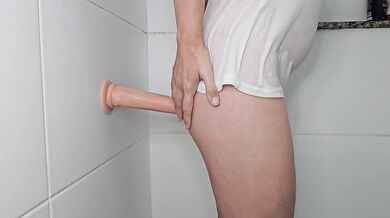 Suction dildo fuck against the wall
