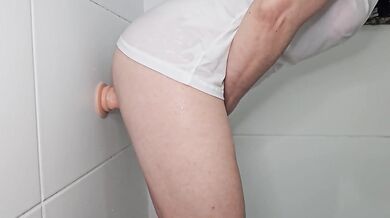 Suction dildo fuck against the wall