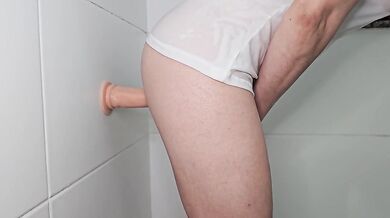 Suction dildo fuck against the wall
