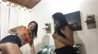 sexy girls caress their bodies, take off their clothes and finger each other's pussies in the bedroo