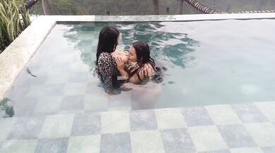 playing in the pool and sucking her tits