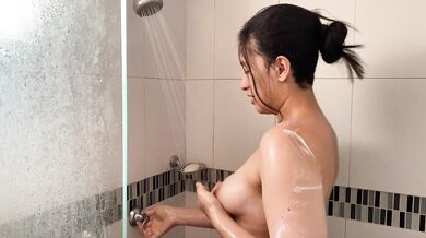 A lesbian calls her roommate to the shower and makes her fuck her
