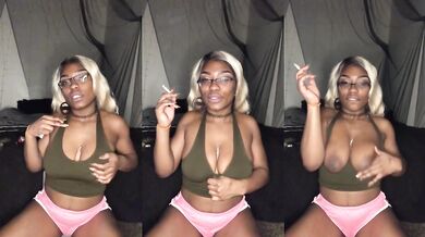 Smoking Milf teases with big tits