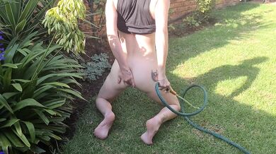 Inserting a hosepipe in my ass and cunt and squirting the water out
