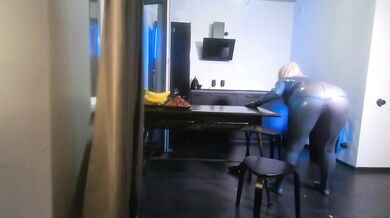 Latex rubber fetish curvy milf woman in blue texturized catsuit. Backstage from the photoshoot.