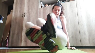 Sweaty feet after workout. Stinky socks and sneakers.Sniffing - OlgaNovem