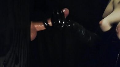 Black latex gloves at the gloryhole