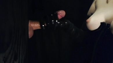 Black latex gloves at the gloryhole