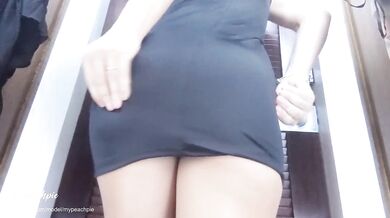 Filming myself in a public changing room trying on skirt and dress.