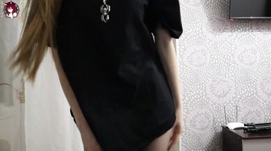 Girl in black pantyhose undresses on camera and shows holes