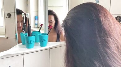 naughty girl masturbates in the bathroom with her boyfriend's toothbrush