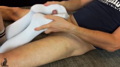 Footjob in Over Knee Socks with feet balls massage. He edges and cums on soles.