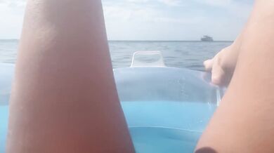 Girl sunbathing on the beach, jerking off and pissing in the sea for the first time !!!