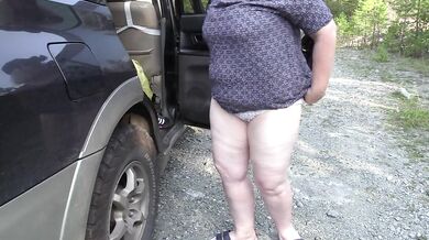 Mature bbw milf with huge saggy tits changes clothes outdoors near the car