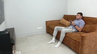 Playing with his dick while he plays Playstation