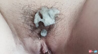 Smoking chubby MILF gets a cumshot on her hairy pussy!