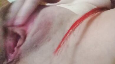 Redhead slut masturbates her wet pussy close-up