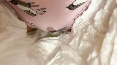 By the Christmas tree pissing in cute panties under a diaper