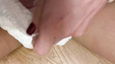 By the Christmas tree pissing in cute panties under a diaper