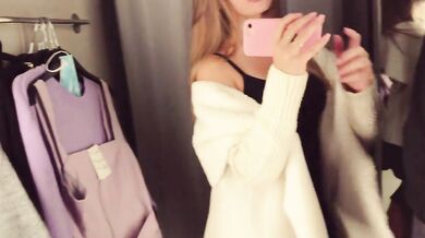A cute girl sucks a dick and takes cum in her mouth, in a fitting room, in a shopping center