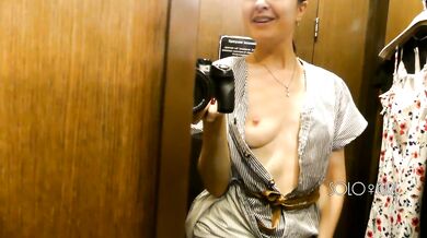 Slutty bitch can't hold back her lust and plays with pussy in fitting room, public masturbation