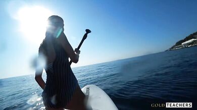 Lustful student seduced a surf instructor and gave him her virginity right in the sea