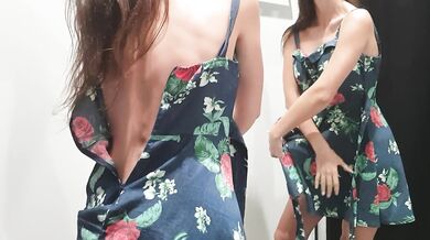 Girl changes clothes in a fitting room