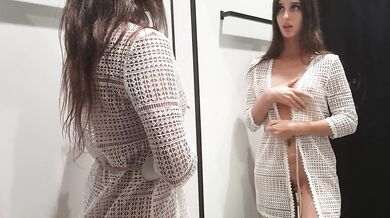 Girl changes clothes in a fitting room