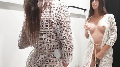 Girl changes clothes in a fitting room