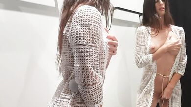 Girl changes clothes in a fitting room