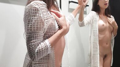 Girl changes clothes in a fitting room