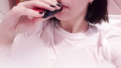 having fun in the bathtub with foam in a wet white top. I smoke and listen to 2rbina2rists