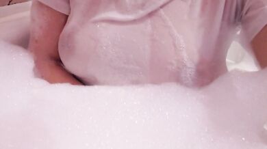 having fun in the bathtub with foam in a wet white top. I smoke and listen to 2rbina2rists