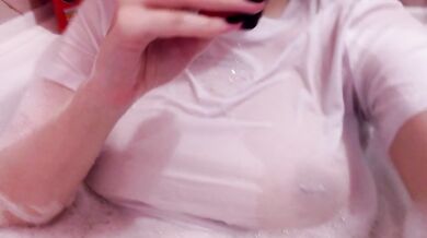 having fun in the bathtub with foam in a wet white top. I smoke and listen to 2rbina2rists