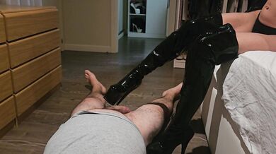 Milf stepping on her slave's cock with boots and using stockings as a condom